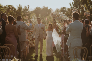 Bride and groom exit wedding ceremony at Flora Farms Los Cabos