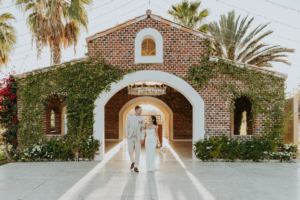 Newlyweds walking at Flora Farms iconic farm