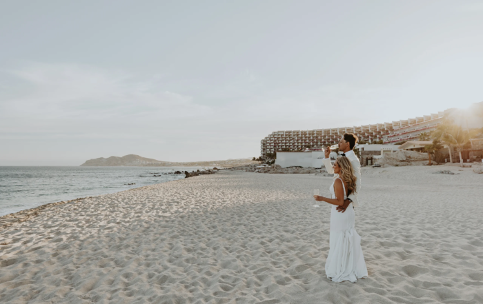 Bride and groom enjoying cocktails at the beach
