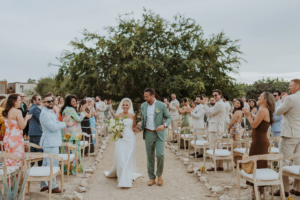 Bride and groom exit their wedding ceremony at AGAVES