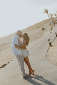 couple poses for photo kissing