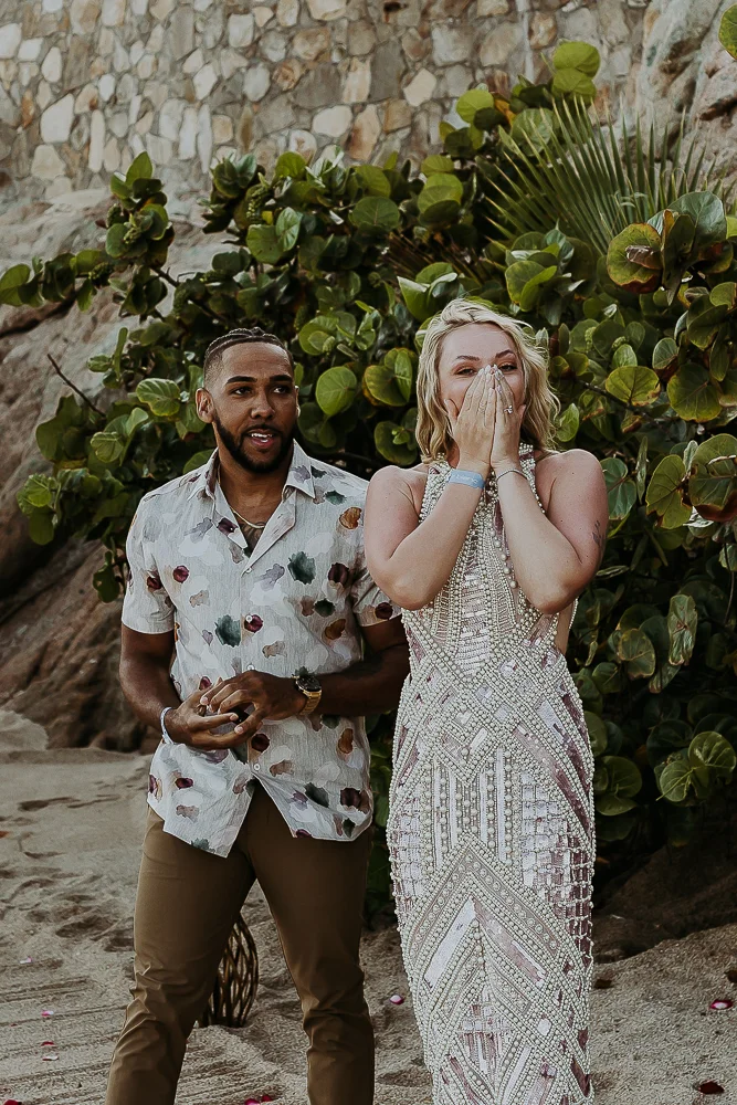 woman surprised as she sees the proposal setup