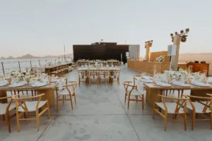 wedding reception decor at terrace overlooking the ocean in Los Cabos