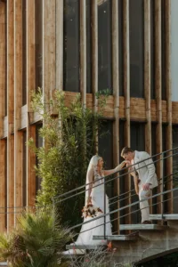 Bride and groom have a photo session at the iconic stairs at The Cape