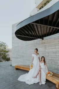 two brides posing for photos