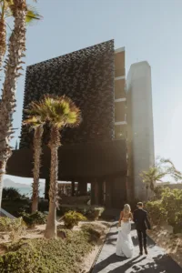 bride and groom entering The Cape Thompson hotel