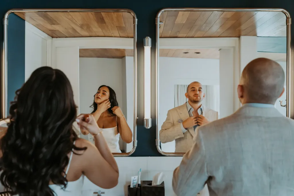 Bride and groom getting ready at their hotel room