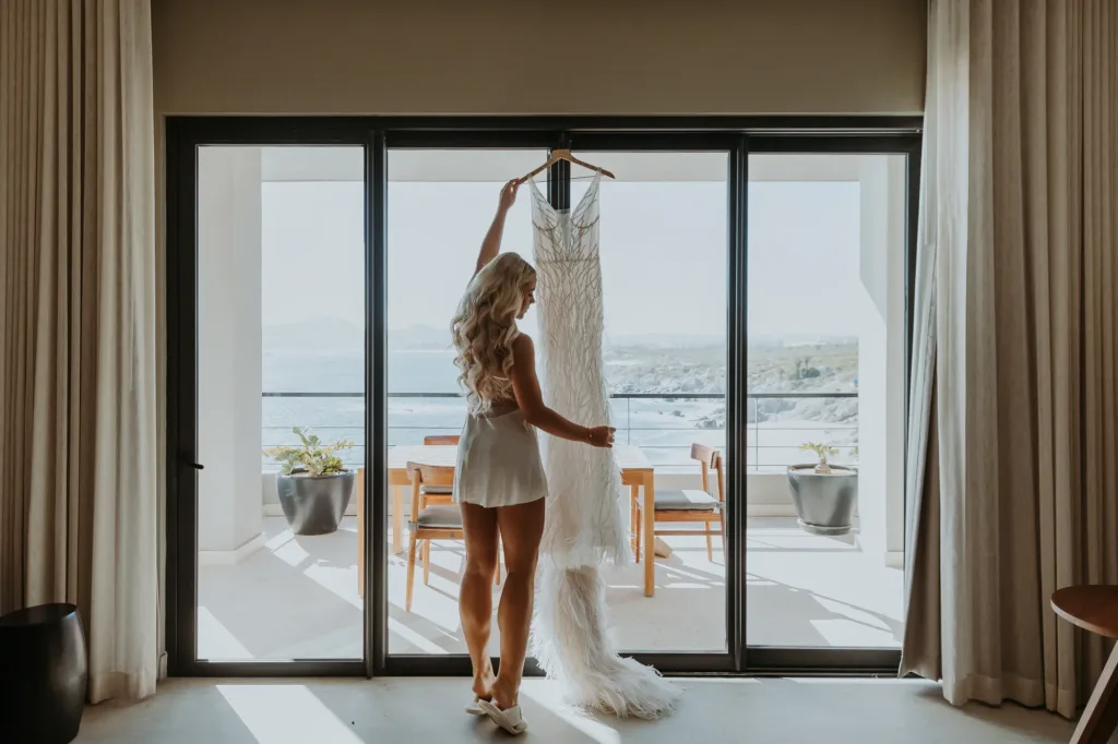 Bride getting wedding gown to get ready