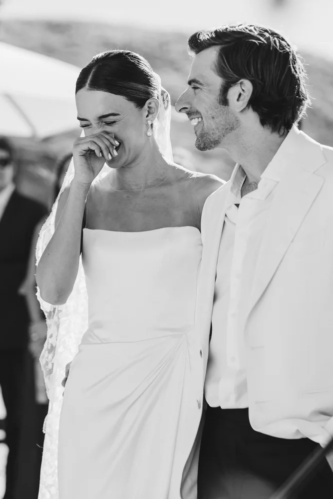 Bride laughing during ceremony