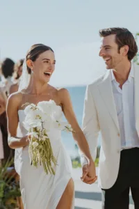 Bride and Groom exit the ceremony laughing