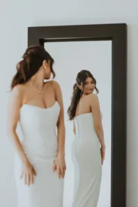 Bride looking at the mirror