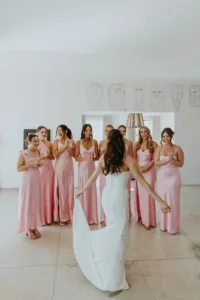 Brides first look with bridesmaids