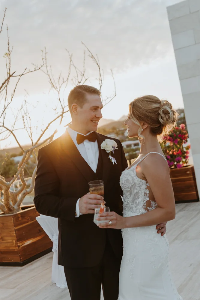 Bride and groom toast with cocktails