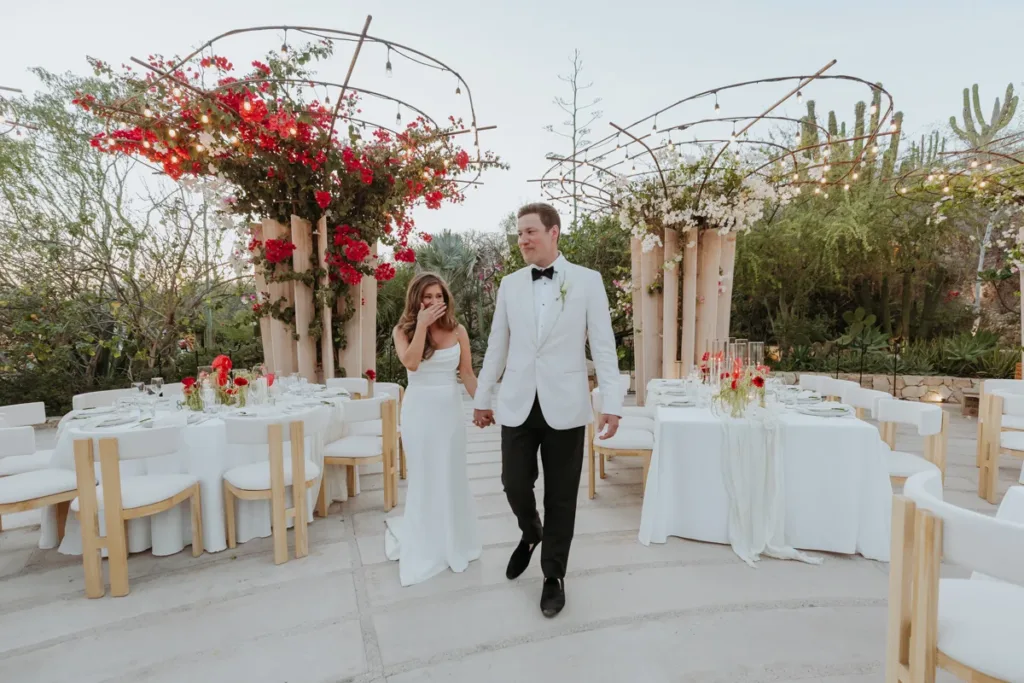 Bride and groom look at their wedding reception at AGAVES ACRE Los Cabos