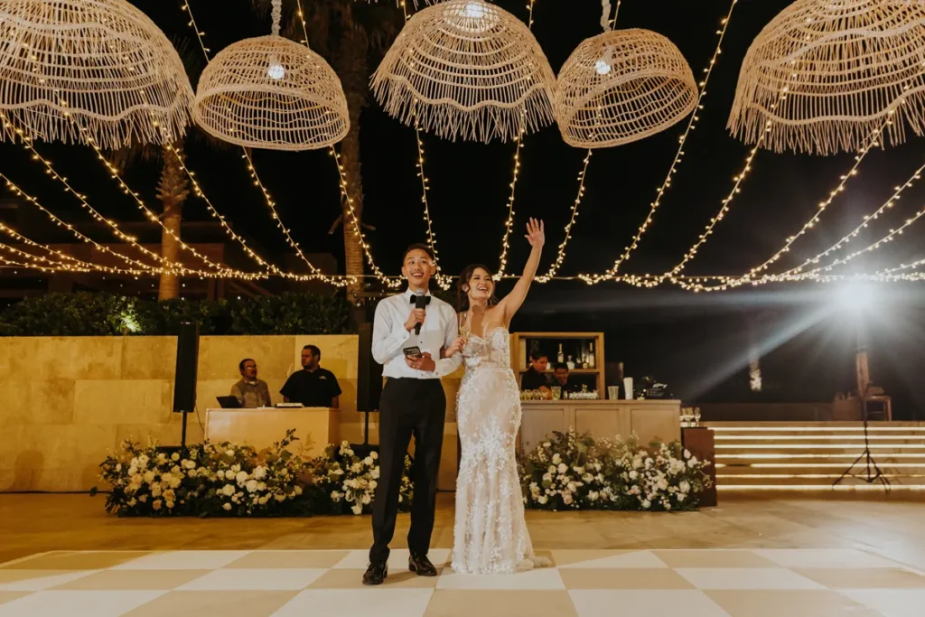 Bride and groom give thank you speech at reception