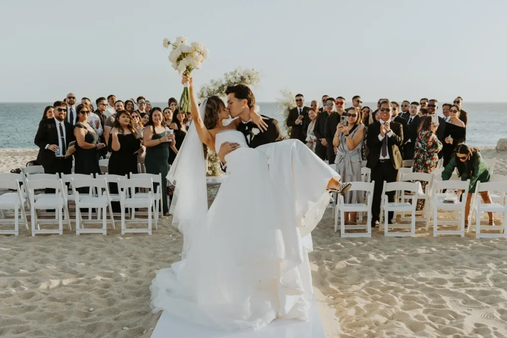 bride and groom celebrate as they exit their ceremony