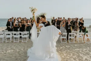 bride and groom celebrate as they exit their ceremony